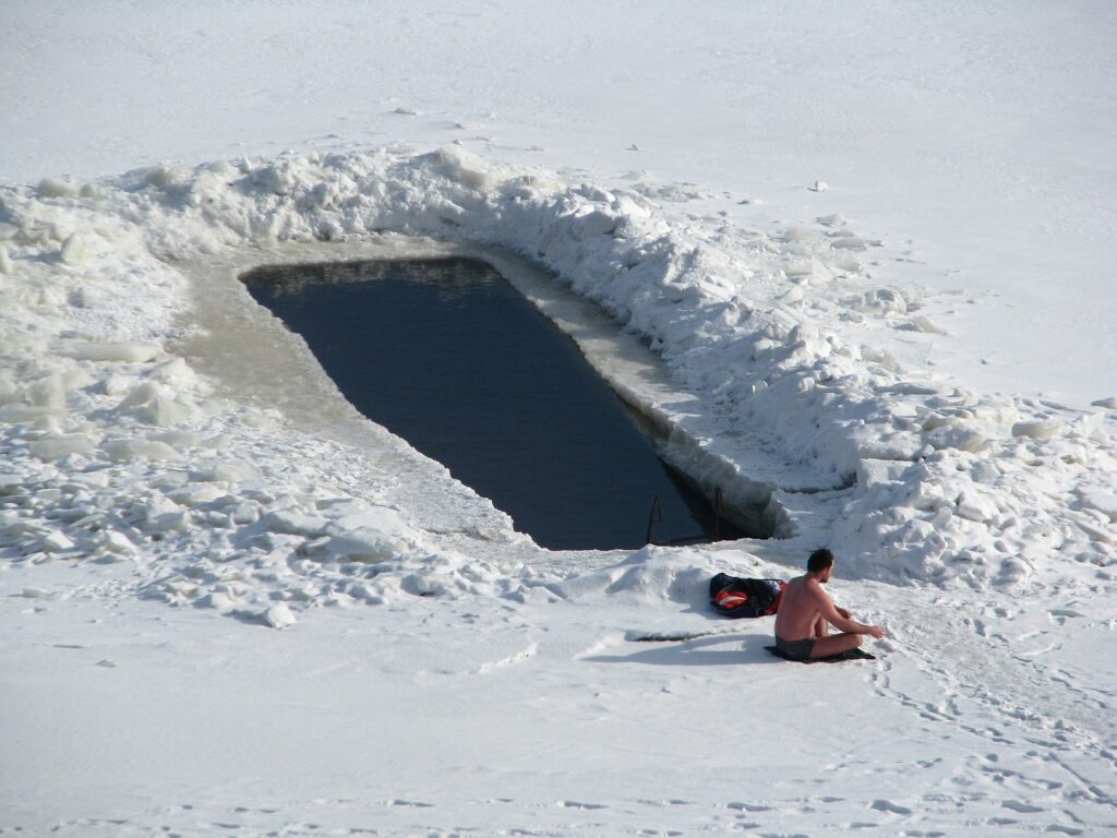 Picture of man beside icy pool.